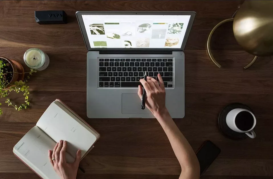 student doing research on laptop